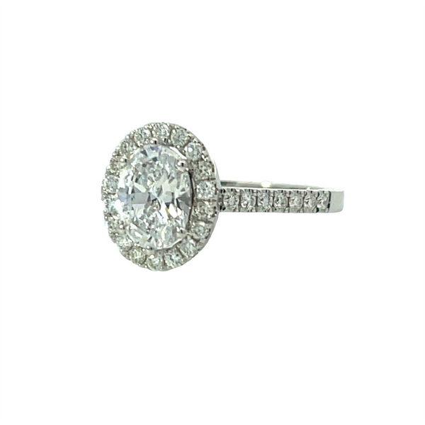 White 14 Karat Gold .45 Carats Oval Diamond Halo Engagement Ring