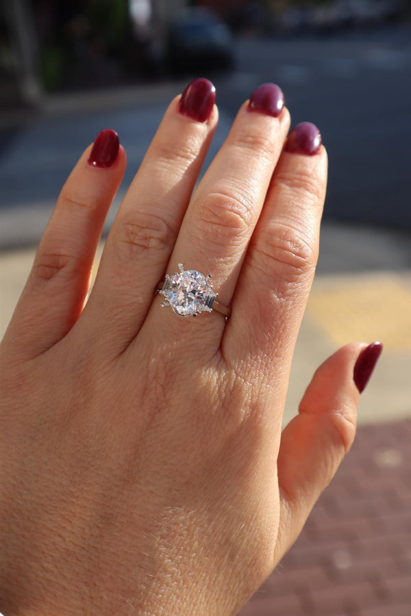 Elegant Diamond Mountings 18K Gold White 11.5x7.5MM Oval 3 Stone Engagement Ring - 0.41 Carats Trapezoid Accent