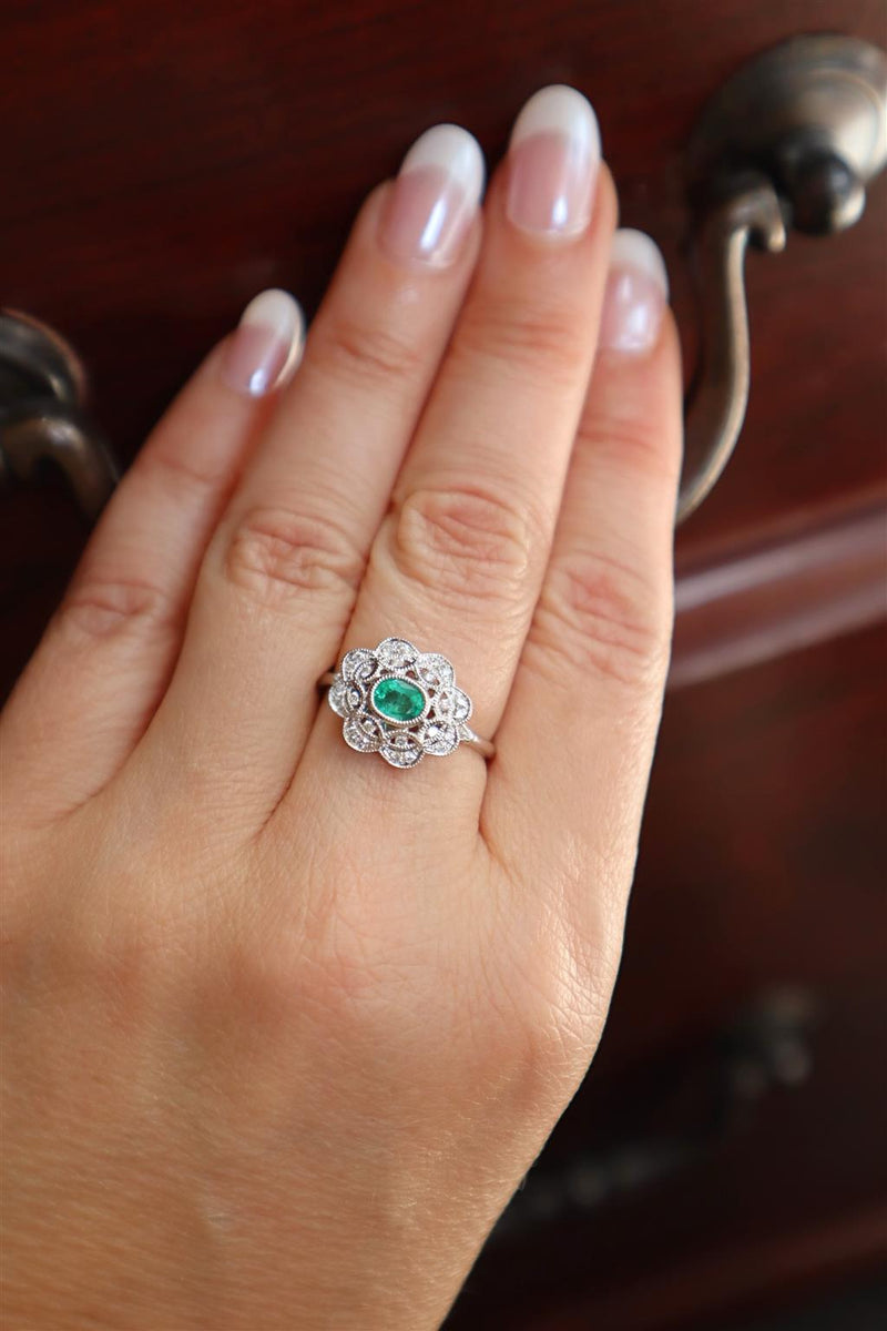 Bold & Elegant 18K White Gold Oval Cut 0.43 Carat Emerald & 0.17 Carat Diamond Floral Vintage Inspired Halo Ring