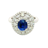 Bold & Elegant 18K White Gold Oval Cut 1.94 Carats Blue Sapphire & 1.26 Carats Baguette & Round Cut Diamond Triple Halo Ring