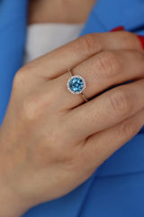 Bold & Elegant 14K White  Gold 1.55 Carats Blue Topaz & 0.10 Carats Diamond Halo Ring