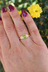 Bold & Elegant 18K Yellow Gold Oval Cut 1.19 Carats Yellowish Green Peridot & 0.07 Carats Diamond Ring