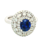 Bold & Elegant 18K White Gold Oval Cut 1.94 Carats Blue Sapphire & 1.26 Carats Baguette & Round Cut Diamond Triple Halo Ring